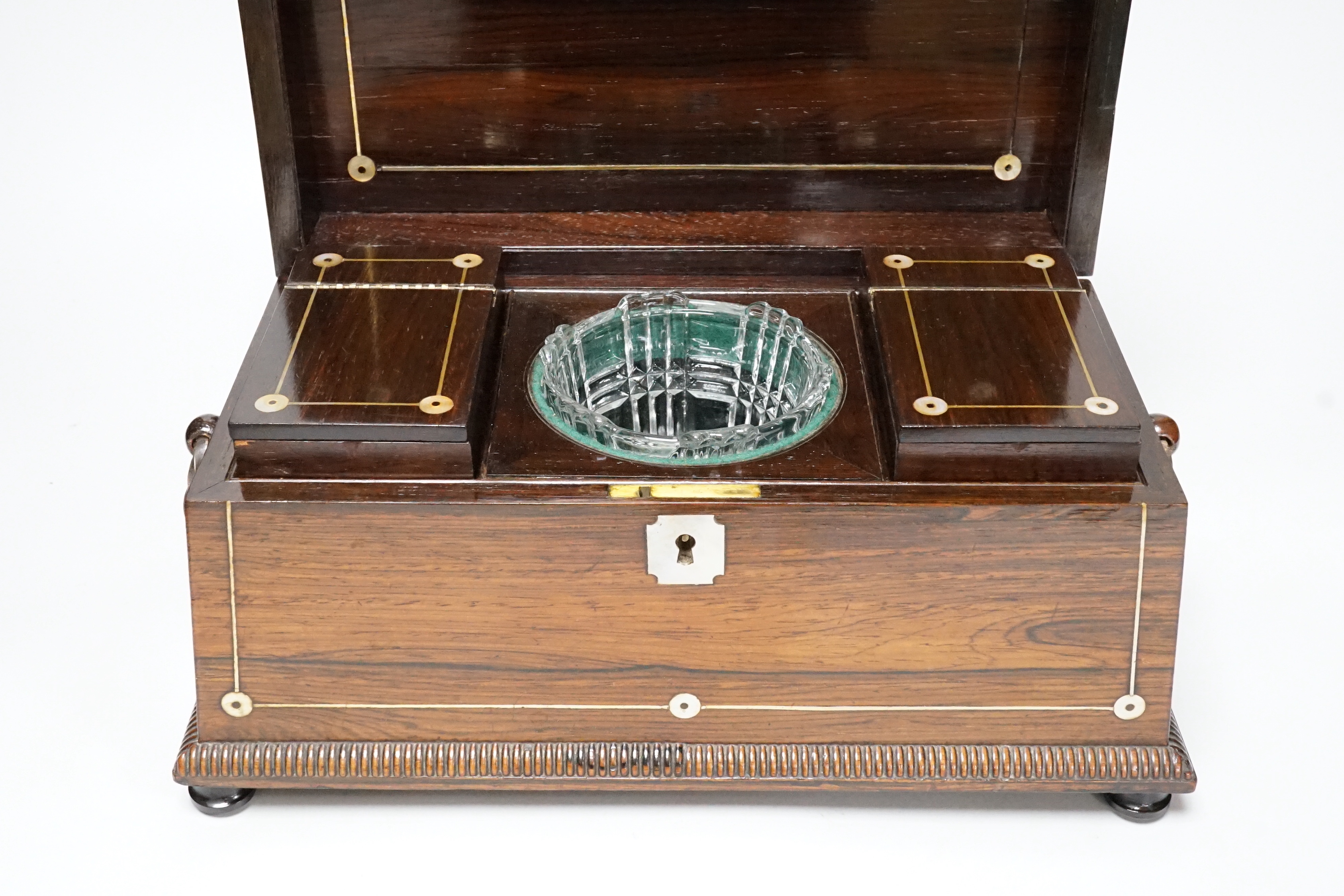 A William IV mother of pearl inlaid rosewood tea caddy, 31cm wide